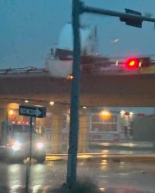 18-Wheeler Precariously Hangs Over I-35 Bridge in Elm Mott; Driver Trapped, Fuel Leaking