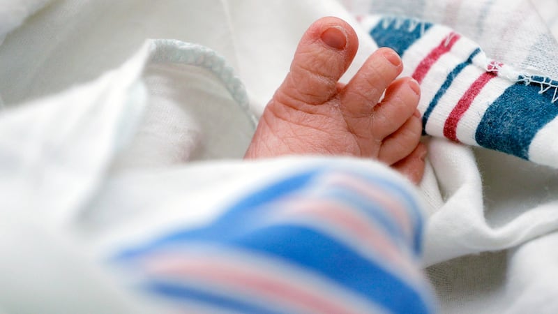 FILE - The toes of a baby peek out of a blanket at a hospital in McAllen, Texas. On Wednesday,...