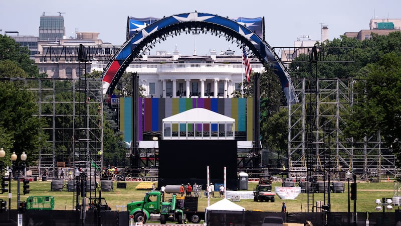 Workers continue building the cage for a future UFC fight on the South Lawn in front of the...