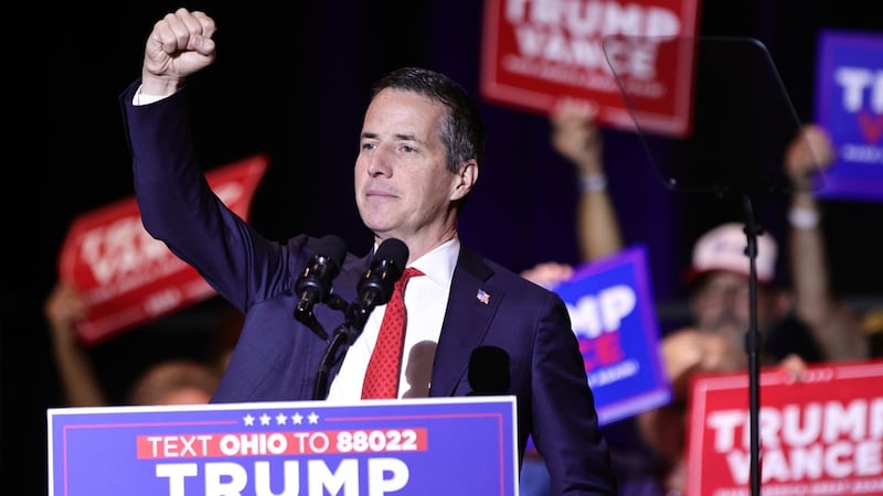 Ohio Republican Senate candidate Bernie Moreno raises his right fist during a rally for...