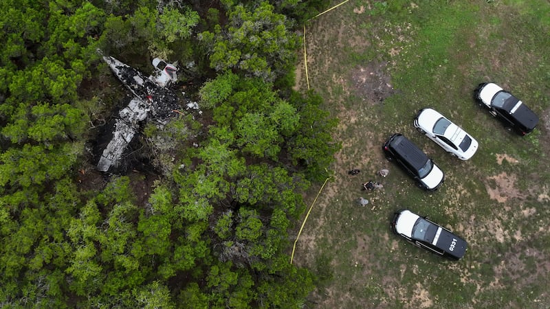 A crashed Cessna airplane is seen in a wooded area on Round Rock Road in Wimberley, Texas,...