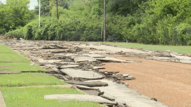 Road behind Westwood Villa Apartments destroyed by flash floods