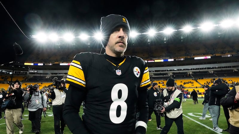 FILE - Pittsburgh Steelers quarterback Aaron Rodgers (8) leaves the field after an NFL...