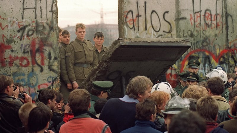 The Iron Curtain wall comes down between East and West Germany