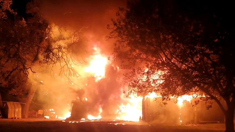 A fire destroyed the J.T. Rogers Cabin, one of only a handful of two-story log cabins...