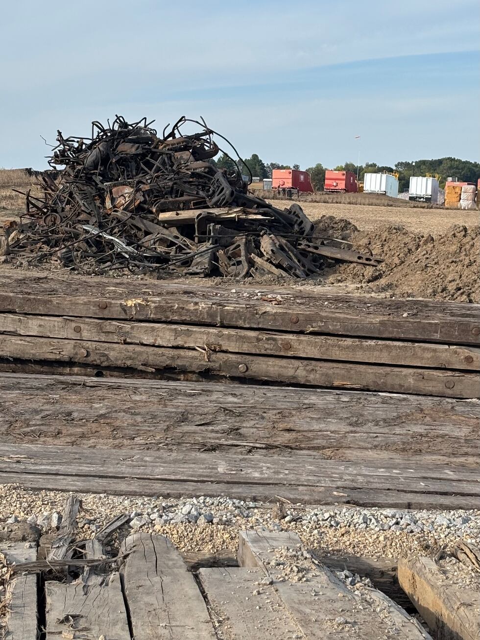 Debris from the August derailment near Reeseville, Wisconsin, sits in tangled piles just off...
