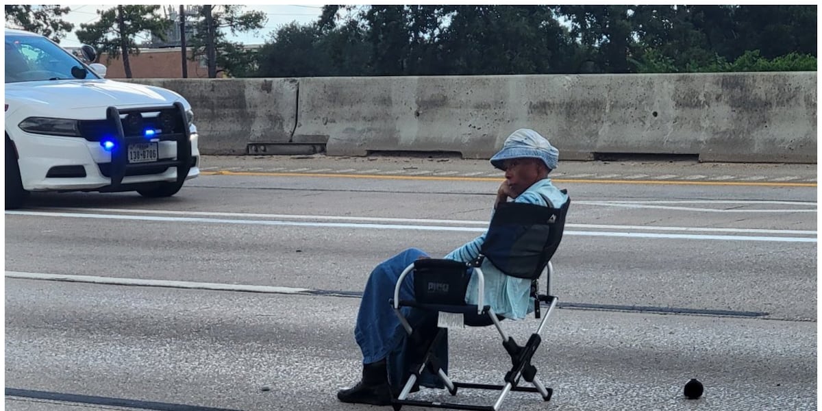 Armed woman sitting on folding chair shuts down I-45 during standoff in Spring, Texas Armed woman sitting on folding chair shuts down I-45 during standoff in Spring, Texas
