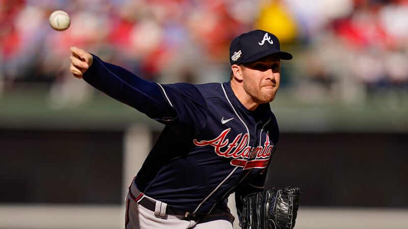 FILE - Atlanta Braves relief pitcher Collin McHugh (32) works during the third inning in Game...