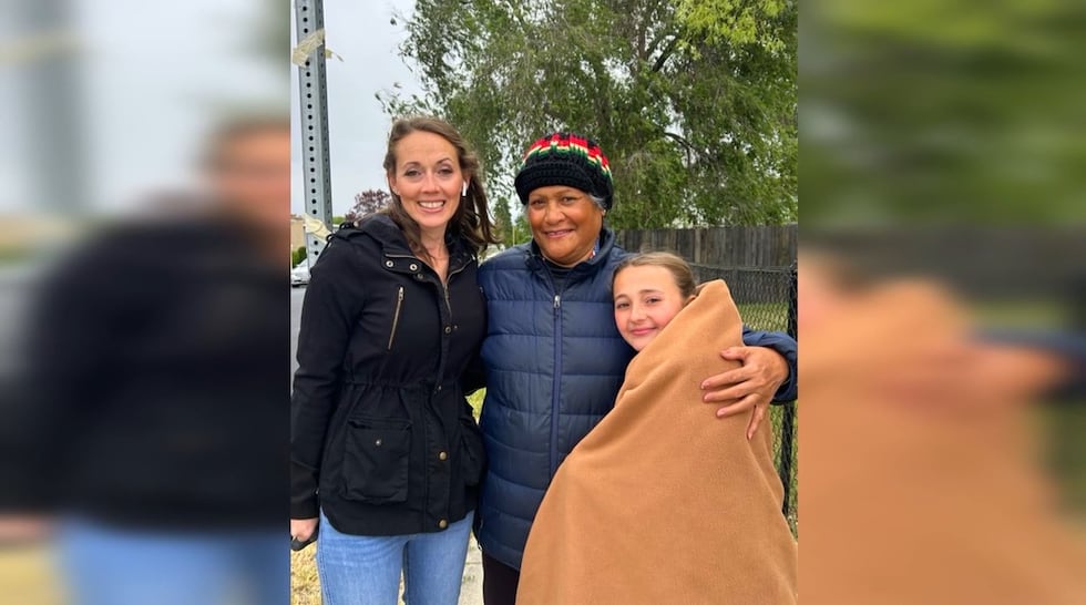 Crossing guard Ruta Pataialii (center) is being hailed as a hero for saving 11-year-old Alexis...