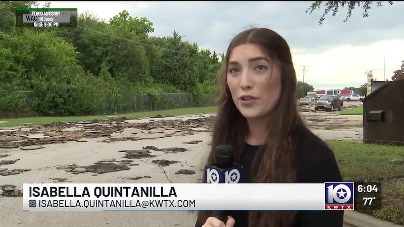 Flooding along Waco Drive tears up road in front of apartment complex